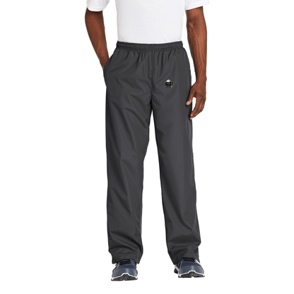 Black Square Golf Wind Pants in Graphite, front view on model with Black Square mascot logo on the left thigh